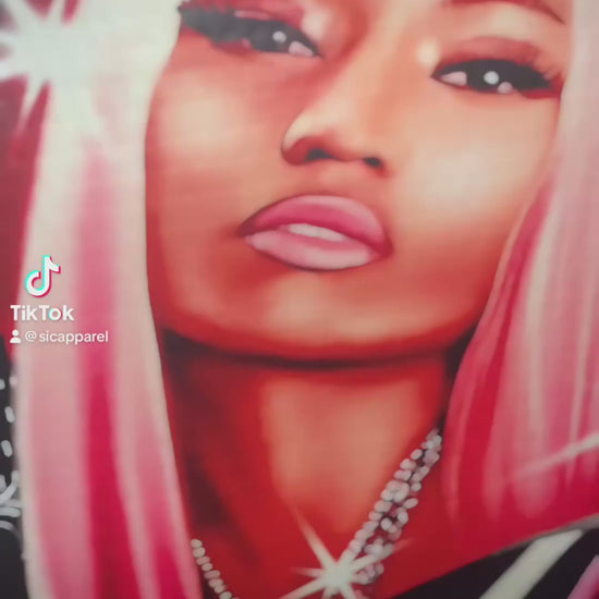 Video of Nicki Minaj dtf transfer before and after print on black shirt