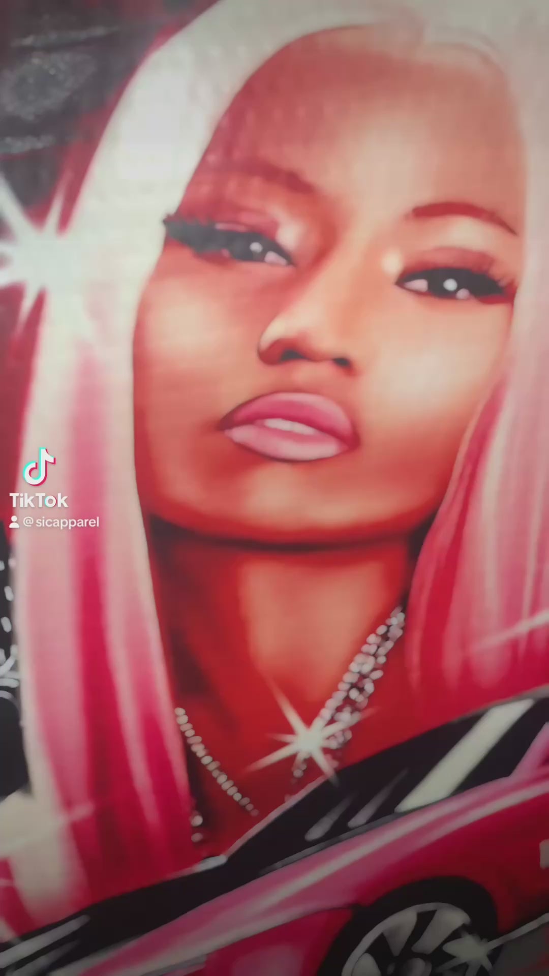 Video of Nicki Minaj dtf transfer before and after print on black shirt