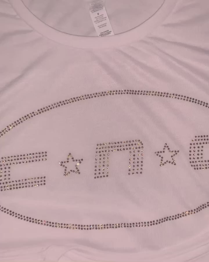 Video of custom rhinestone design  on white t shirt
