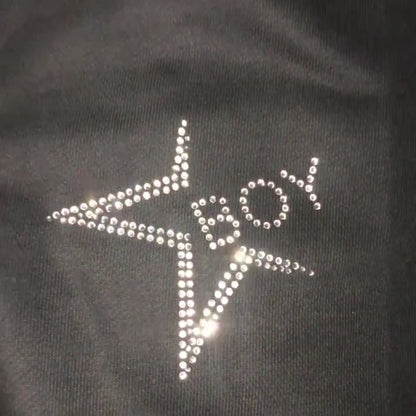 Video of custom rhinestones design  on black sweatsuit 