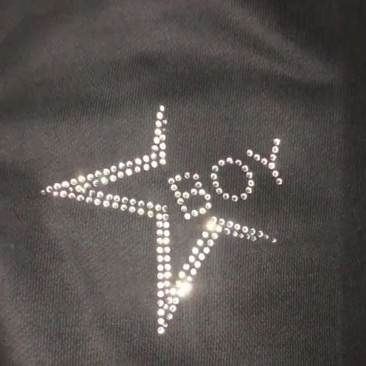 Video of custom rhinestones design  on black sweatsuit 