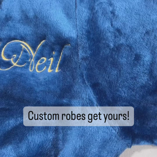 Video of Plush fleece navy blue bathrobe with hood and custom embroidery name.