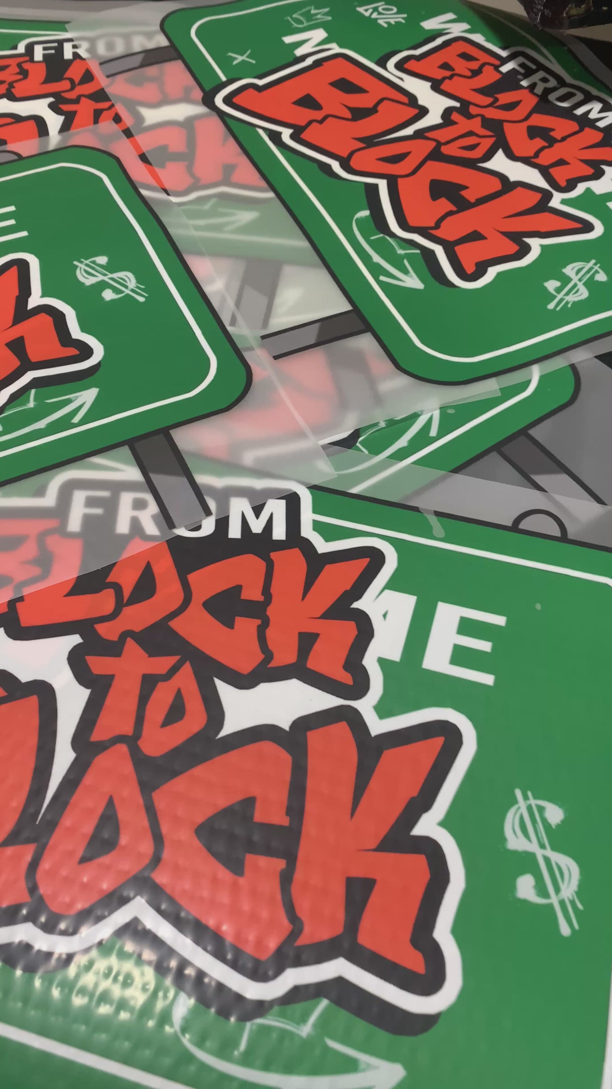 Video of cut dtf transfers ready to be heat pressed onto hoodies and t shirts 
